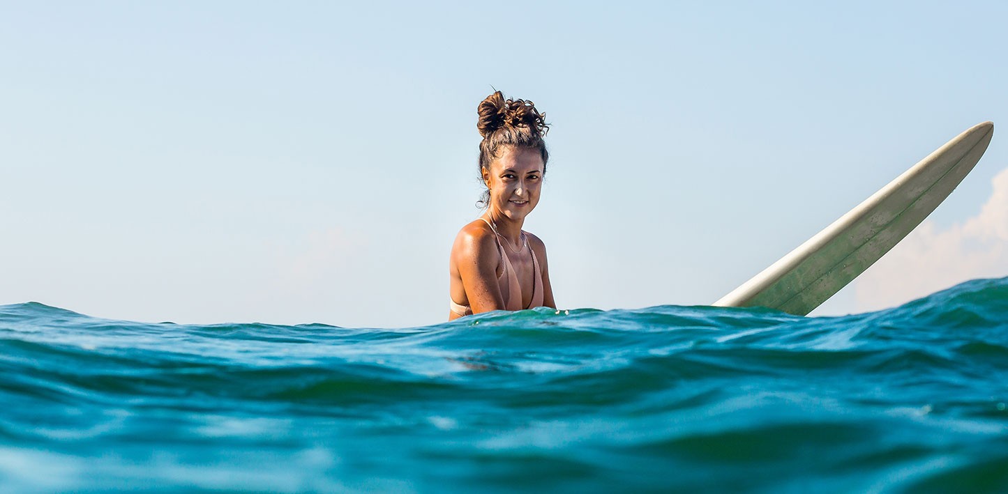 Woman on Surf Board in Water